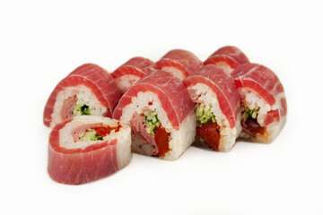 Sushi roll in rice paper with tuna on a white plate, classic Japanese sushi. Traditional Japanese food with maki Delicious pieces of sushi For the restaurant menu. copyspace.