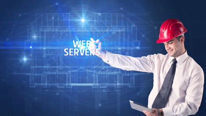 Handsome architect with helmet drawing WEB SERVERS inscription, new technology concept