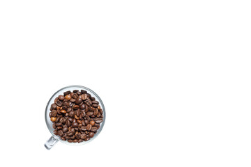 transparent cup full of roasted coffee beans on a white background.