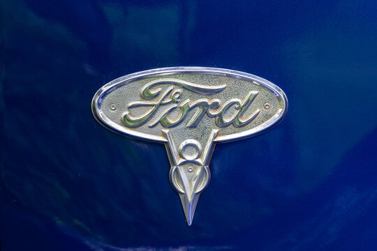 DIEDERSDORF, GERMANY - AUGUST 30, 2020: The emblem of retro car Ford V8, close-up. The exhibition of "US Car Classics".