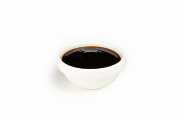 Teriyaki sauce in a bowl on a white background. For the restaurant menu. Traditional Japanese sushi seasoning. Healthy eating