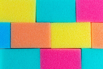 Colored sponges for washing dishes. Mock-up. Background. Cleaning.