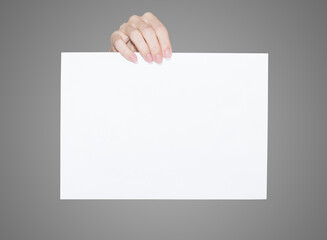 White blank sheet with female fingers