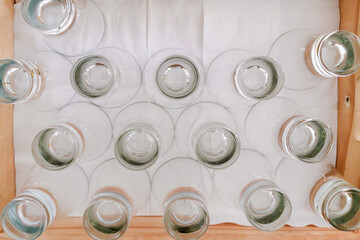 Top view of Bulk group of empty clear glass for buffet, group meeting and ready to serve in hotel, Conventional Hall.