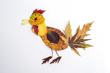 autumn nature craft for kids, bird made of dry leaf, top view, activity for children