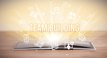 Fototapeta premium Opeen book with TEAM BUILDING inscription, business concept
