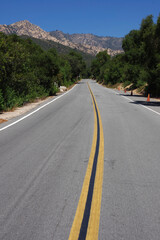 Long empty road leading from Santa Barbara into the Santa Ynez mountains in southern California