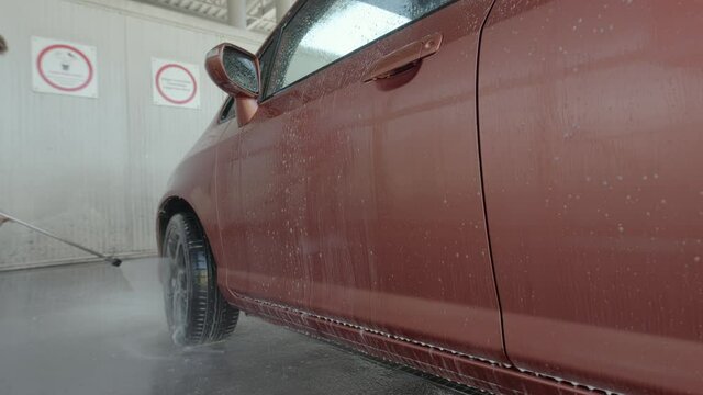 Eashing dirty car closeup footage