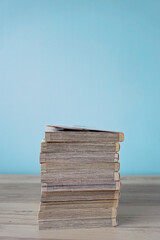 Comic books placed in a pile.  山積みのマンガ本