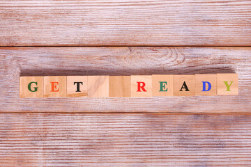 Get Ready word on wooden background. Business concept
