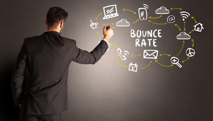 businessman drawing social media icons with BOUNCE RATE inscription, new media concept