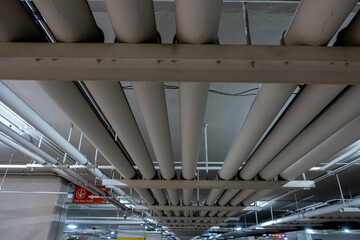 Underground piping service system in an office building car parking delivering fresh water, sewage, electrical and gas to the offices and shop floors above