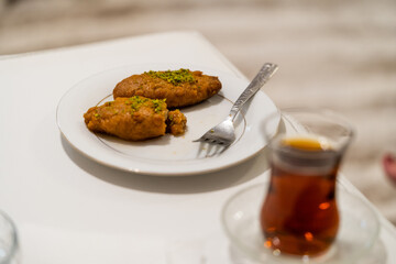 Turkish Dessert Kalburabasti / Sekerpare with Traditional Tea.