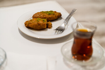 Turkish Dessert Kalburabasti / Sekerpare with Traditional Tea.