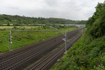 
view of the tracks for trains and stones on them and the surrounding nature of the Czech Republic