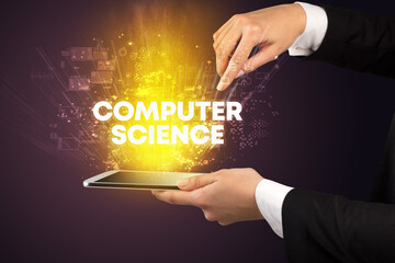 Close-up of a touchscreen with COMPUTER SCIENCE inscription, innovative technology concept