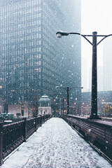 Snow on bridge in city