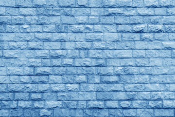 Pastel blue brick building wall texture background for design