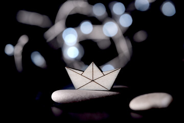 small wooden toy boat on a bright background
