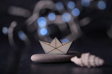 small wooden toy boat on a bright background