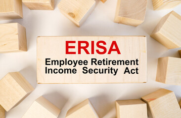 Page with ERISA The Employee Retirement Income Security Act on a piece of wood. medical concept.