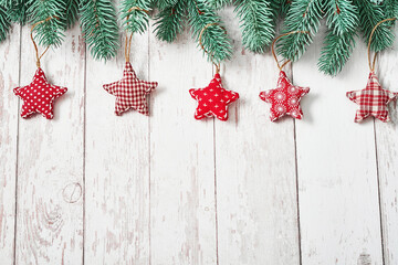 Christmas tree red toys background. Pine branches on white wooden background. Flat lay. Copy space. Happy New Year greeting card. Christmas and New Year holiday. Winter holidays and vacations