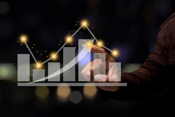 Businessman pointing spot on the graph finance chart.