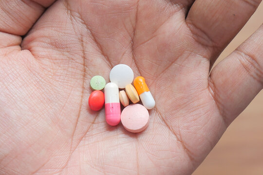 Close Up Of Pills And Capsule On Hand 