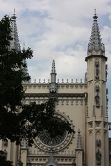 Fototapeta na wymiar Beautiful grey Gothic chapel in the Park