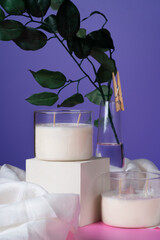 soy candle made with your own hands, with natural natural stones and minerals. On a bright pink background. High quality photo