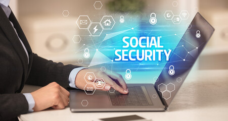 SOCIAL SECURITY inscription on laptop, internet security and data protection concept, blockchain and cybersecurity