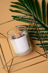soy candle made with your own hands, with natural natural stones and minerals. On a bright pink background. High quality photo