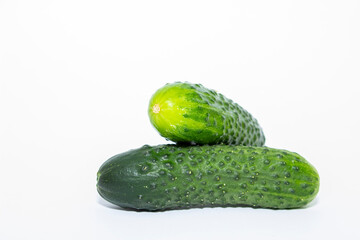 Two green cucumbers isolated on white background