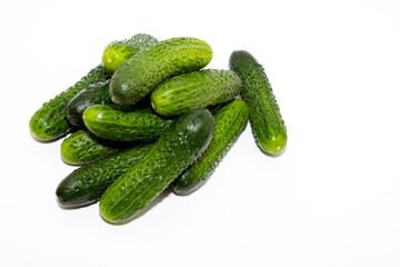 Group of green home grown cucumbers isolated on white background
