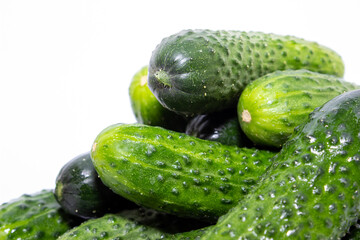 Group of green home grown cucumbers isolated on white background