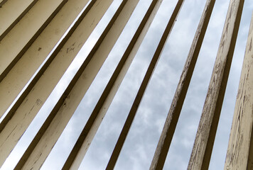 wooden planks on a background of sky and clouds