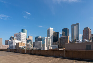 Obraz na płótnie Canvas View of Houston Tall Buildings from Roof top Parking with Clear Skies