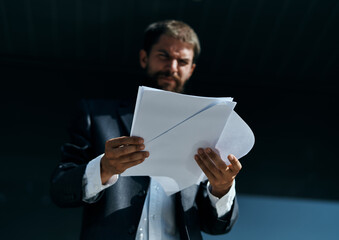 Business man outdoors with documents in hands near building official lifestyle