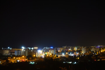 Fototapeta na wymiar city glows with bright colored lights