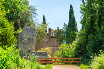 Cisterna di Latina, Italy. June 28th, 2020. Medieval remains of the ancient village of Ninfa in the Garden of Ninfa. - obrazy, fototapety, plakaty