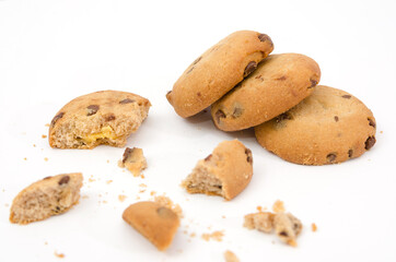 Fototapeta na wymiar delicious cookies with pieces of cookies and crumbs isolated on a white background.