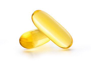 Close up two Fish oil capsules isolated on white background with clipping path