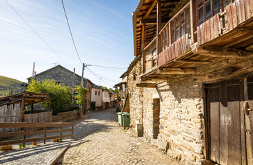 Fototapeta na wymiar a street with typical old houses in Rio de Onor village, municipality of Braganca, Tras-os-Montes, Portugal