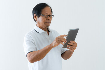 Portrait of Asian senior man using a digital tablet