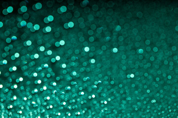 Abstract green bokeh texture on green background