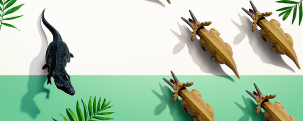 Tyrannosaurus and triceratops figures with shadow - flat lay © Tierney