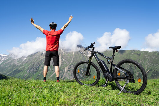E Bike Mountain Bicycle In Austria. Excited Man