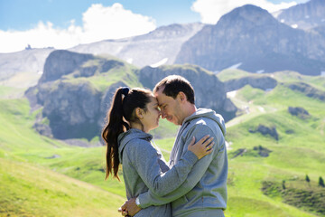 Fototapeta na wymiar Romantic Family Couple In Mountains In Austria