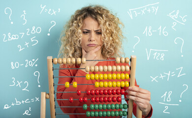 Girl with abacus is confused about the sum . cyan background