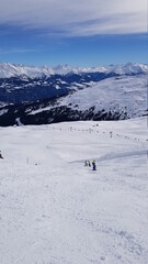 Fototapeta na wymiar Skiing in the beautiful mountains of the Laax ski resort in Flims, Switzerland